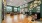 a clubhouse room with chairs, tables and wood floors