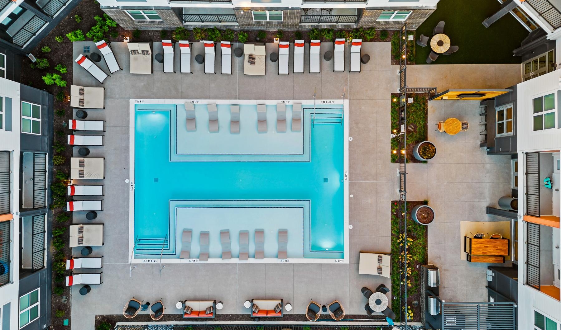Resort-style swimming pool a swimming pool in a courtyard