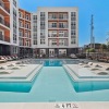 a swimming pool in front of a building