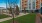 a green lawn in front of a building